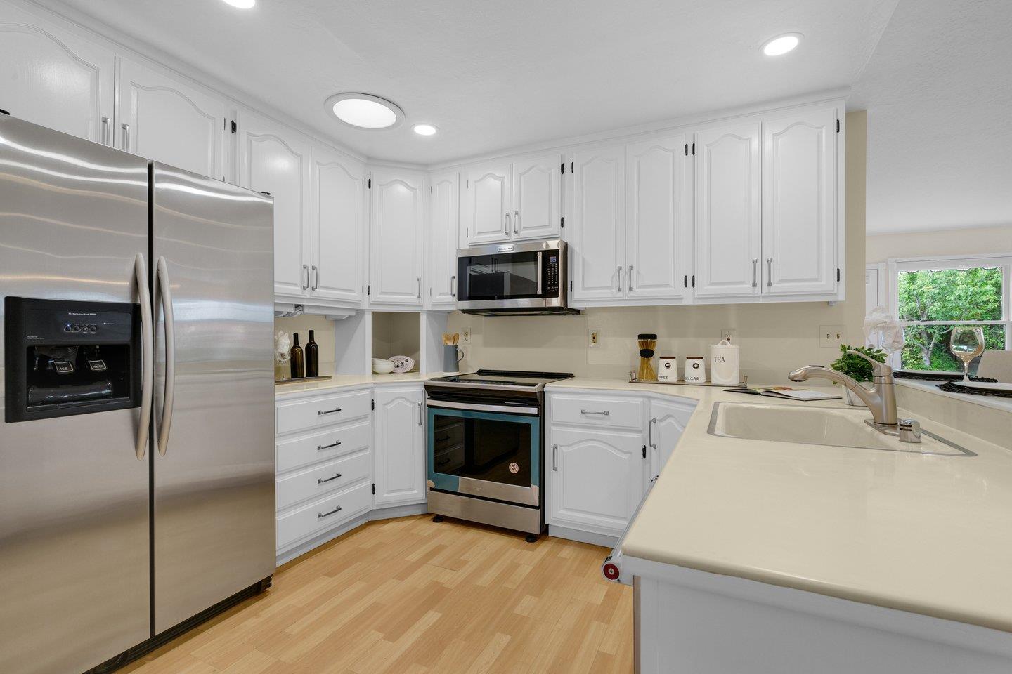 2153 Lacey Drive Milpitas, CA 95035 - Photo 16 of 42 a kitchen with cabinets stainless steel appliances and a counter space