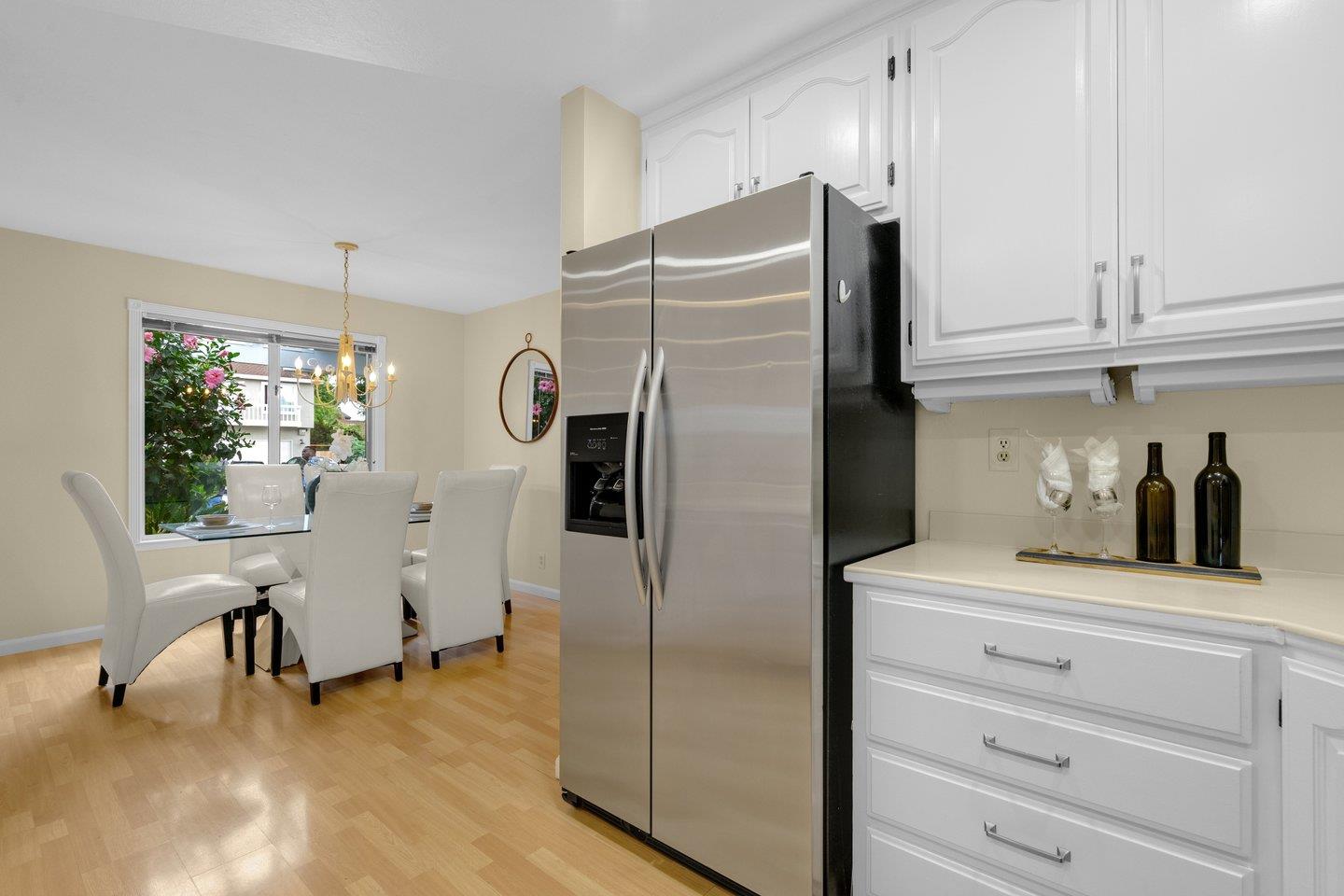 2153 Lacey Drive Milpitas, CA 95035 - Photo 17 of 42 a kitchen with granite countertop a refrigerator and a cabinets
