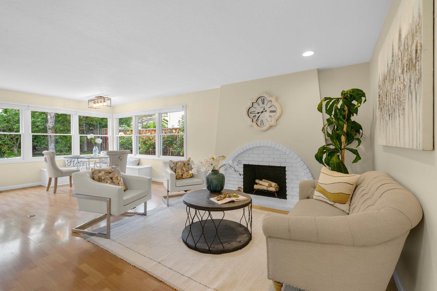 2153 Lacey Drive Milpitas, CA 95035 - Photo 18 of 42 a living room with furniture a fireplace and a large window