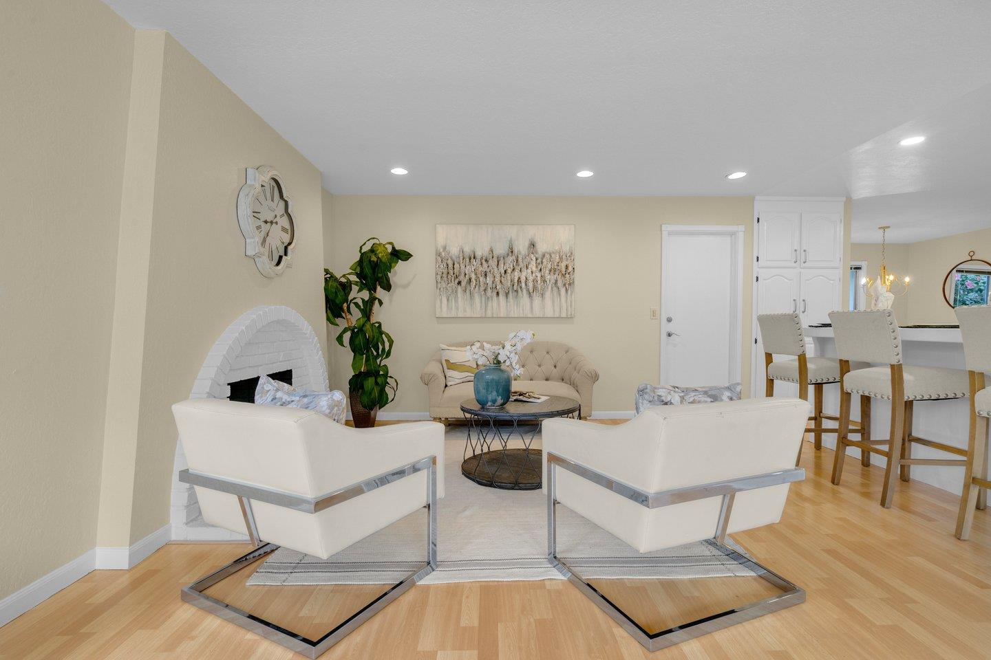 2153 Lacey Drive Milpitas, CA 95035 - Photo 20 of 42 a living room with fireplace furniture and a wooden floor