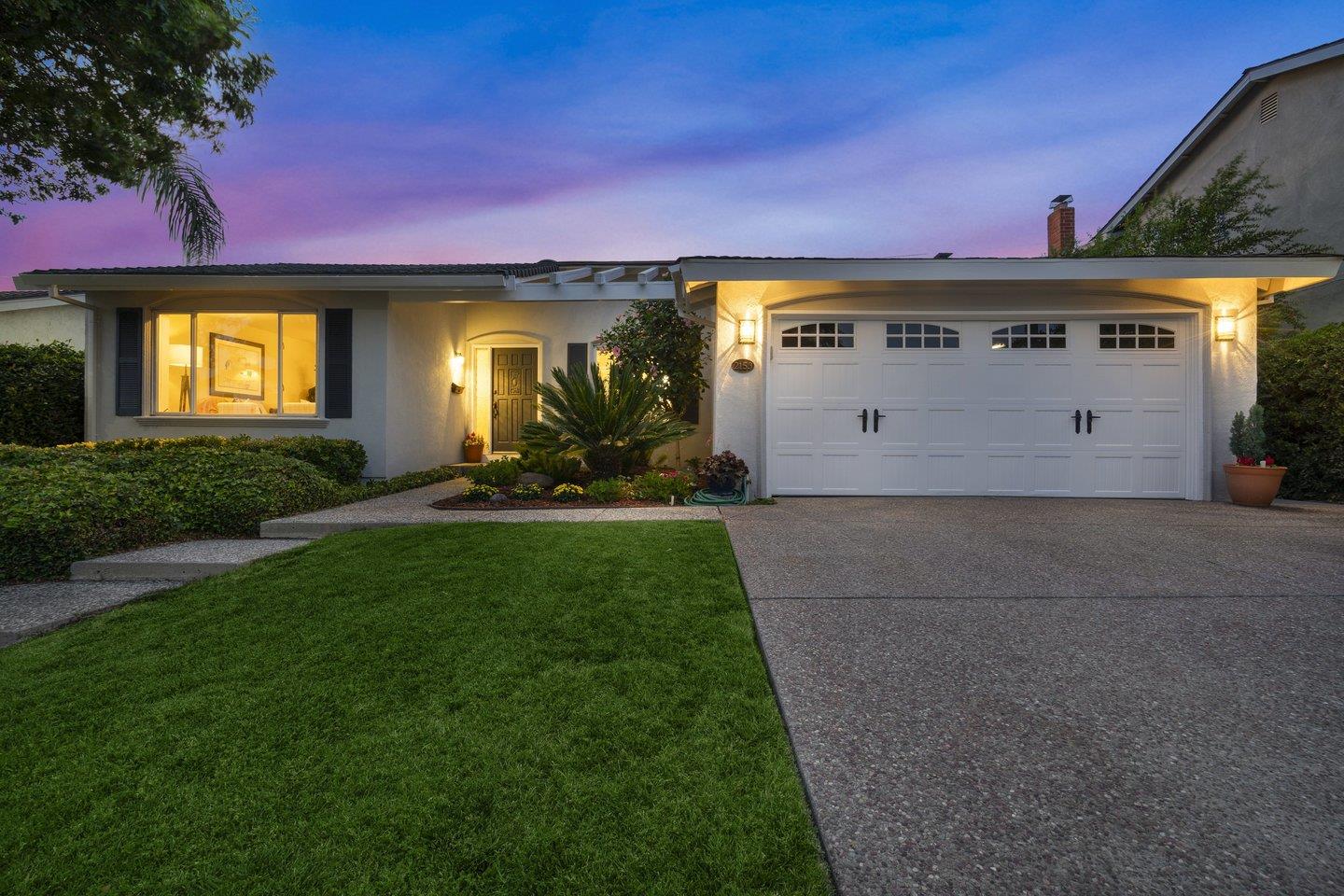 2153 Lacey Drive Milpitas, CA 95035 - Photo 2 of 42 a front view of a house with a yard and garage