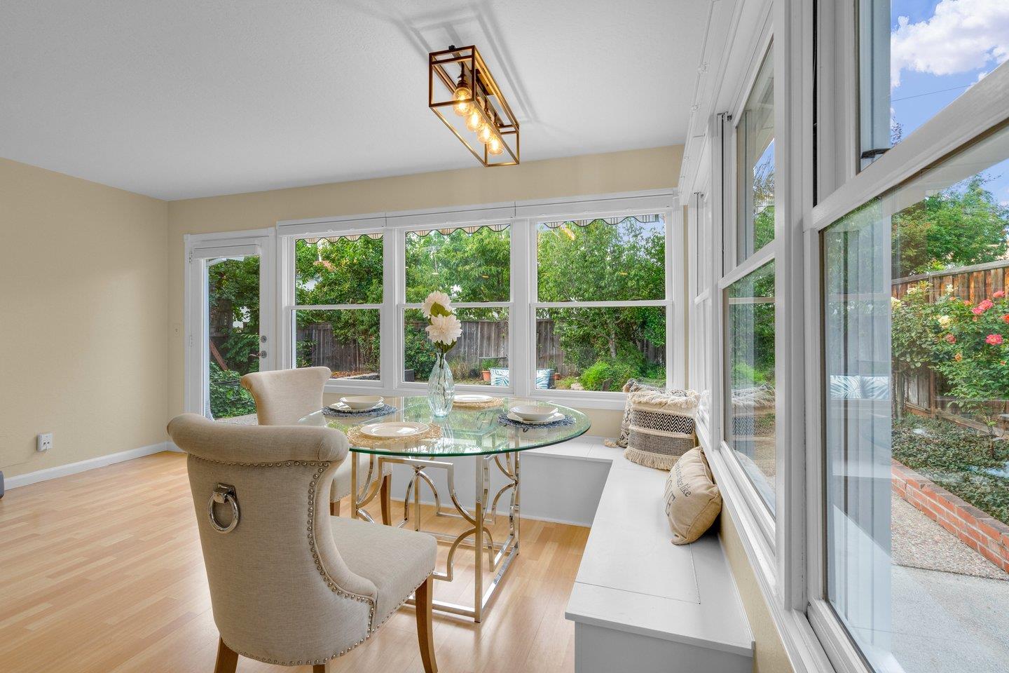 2153 Lacey Drive Milpitas, CA 95035 - Photo 23 of 42 a dining room with furniture a chandelier and wooden floor