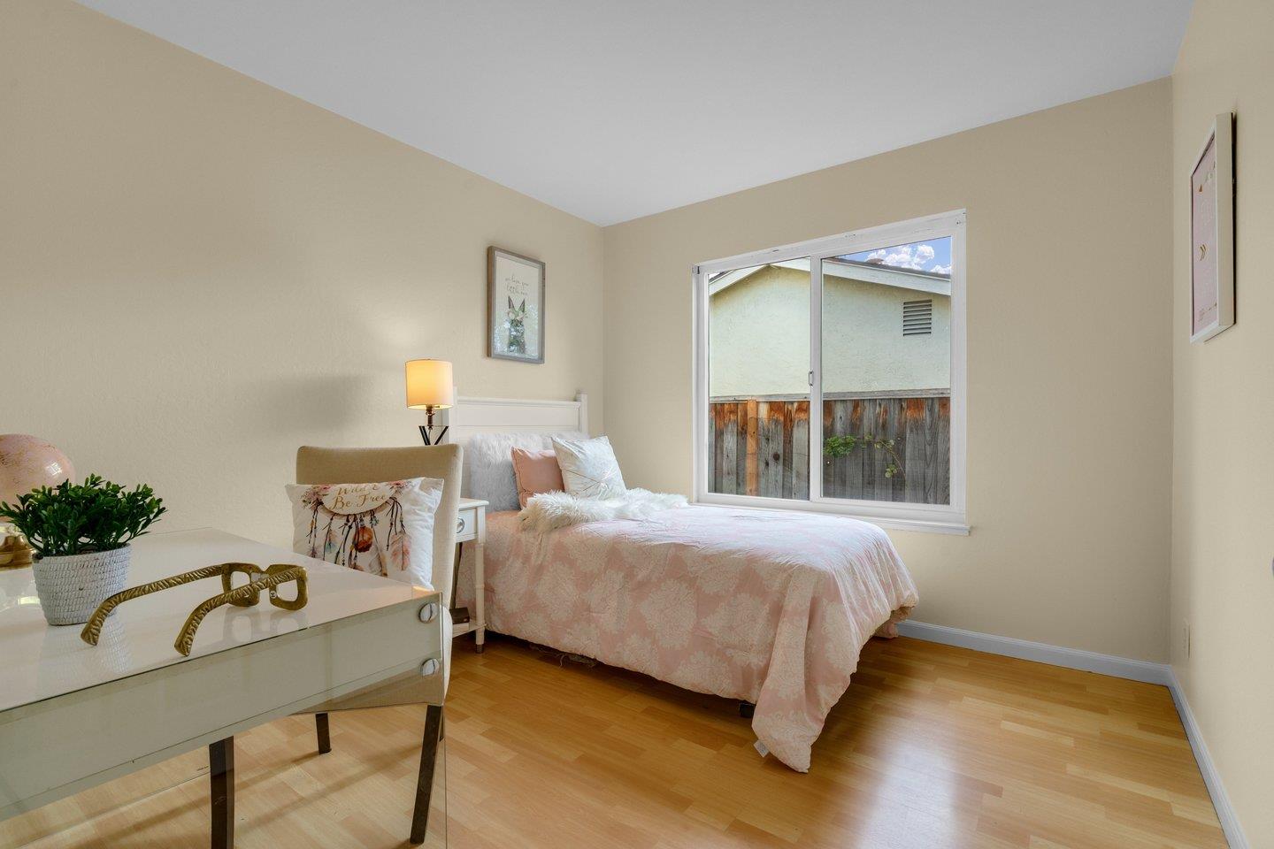 2153 Lacey Drive Milpitas, CA 95035 - Photo 26 of 42 a bedroom with a bed and a table