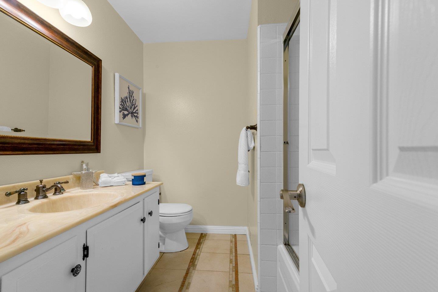 2153 Lacey Drive Milpitas, CA 95035 - Photo 27 of 42 a bathroom with a sink and a mirror