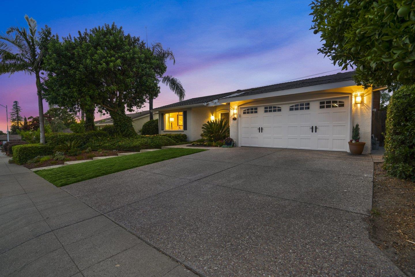 2153 Lacey Drive Milpitas, CA 95035 - Photo 3 of 42 a front view of a house with a yard and garage