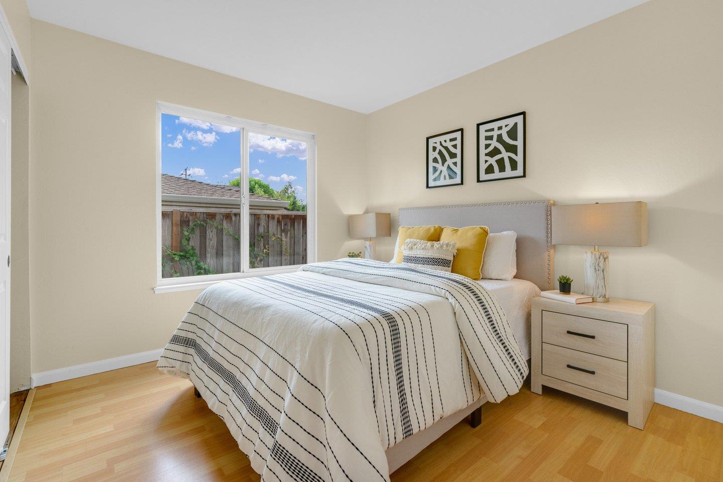 2153 Lacey Drive Milpitas, CA 95035 - Photo 31 of 42 a bedroom with a bed and a large window