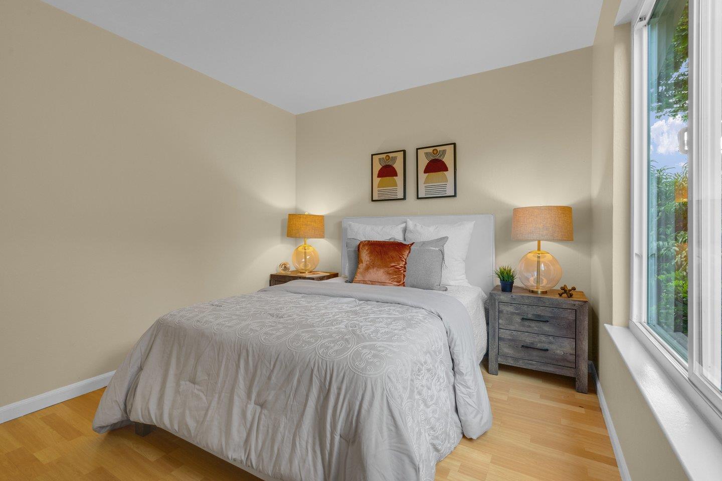 2153 Lacey Drive Milpitas, CA 95035 - Photo 33 of 42 a bedroom with a bed and a lamp on dresser