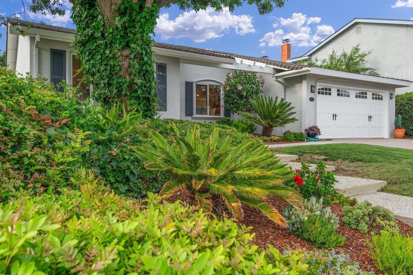 2153 Lacey Drive Milpitas, CA 95035 - Photo 6 of 42 a view of a house with a flower garden