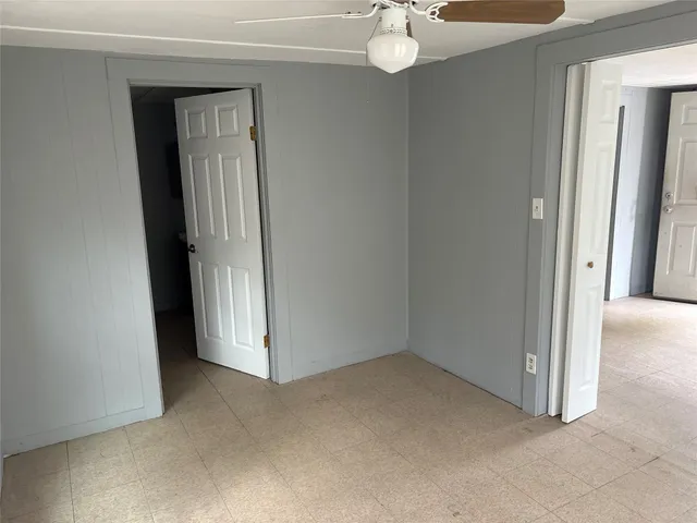 an empty room with a mirror