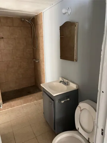 a bathroom with a sink toilet and vanity