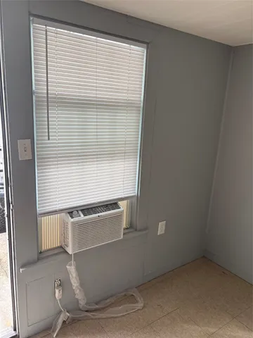 an empty room with wooden floor