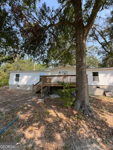 a backyard of a house with lots of green space