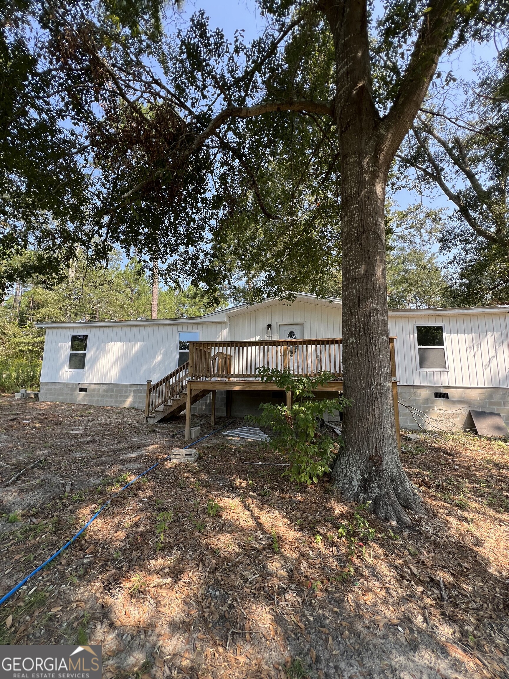 a backyard of a house with lots of green space