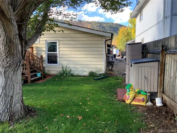 a view of backyard with a garden and plants