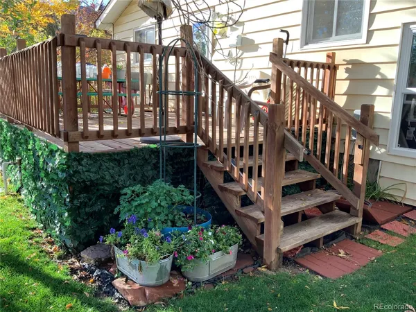 a view of a house with wooden fence