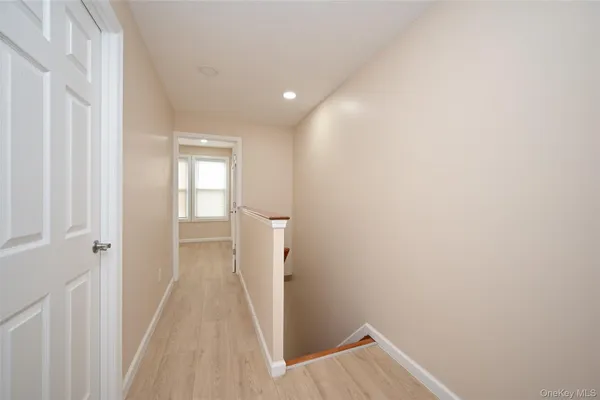 a view of a room with a hallway