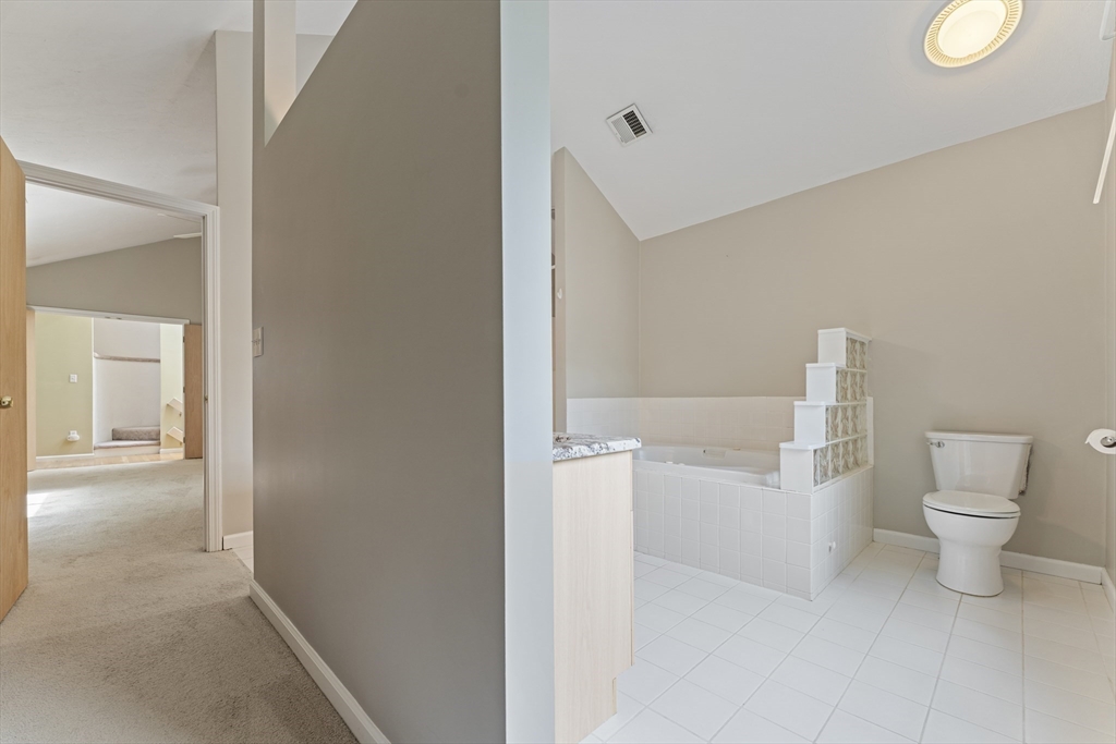 22 Arrowhead Circle, Unit 22 Ashland, MA 01721 - Photo 21 of 35 a bathroom with a toilet