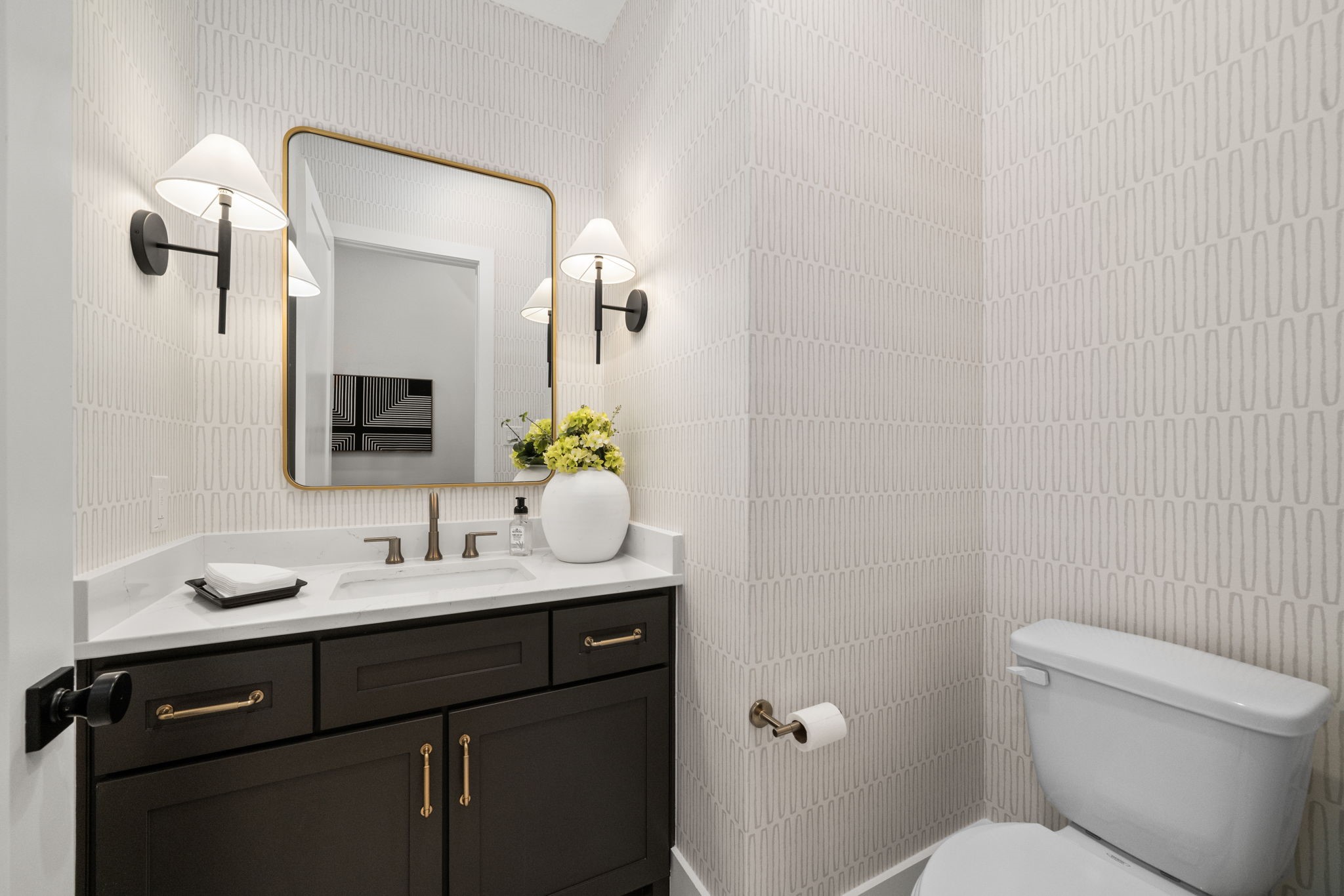 9839 Warwana Road Houston, TX 77080 - Photo 38 of 40 a bathroom with a toilet sink and mirror