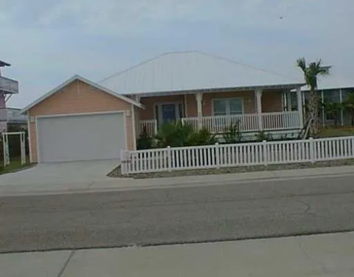 a front view of a house with a fence