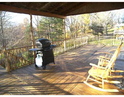 8849 Willoughby Road Pittsburgh, PA 15237 - Photo 13 of 17 Patio/Deck. Entertain on the wood deck which runs the entire length of home -- half is covered and half is open!