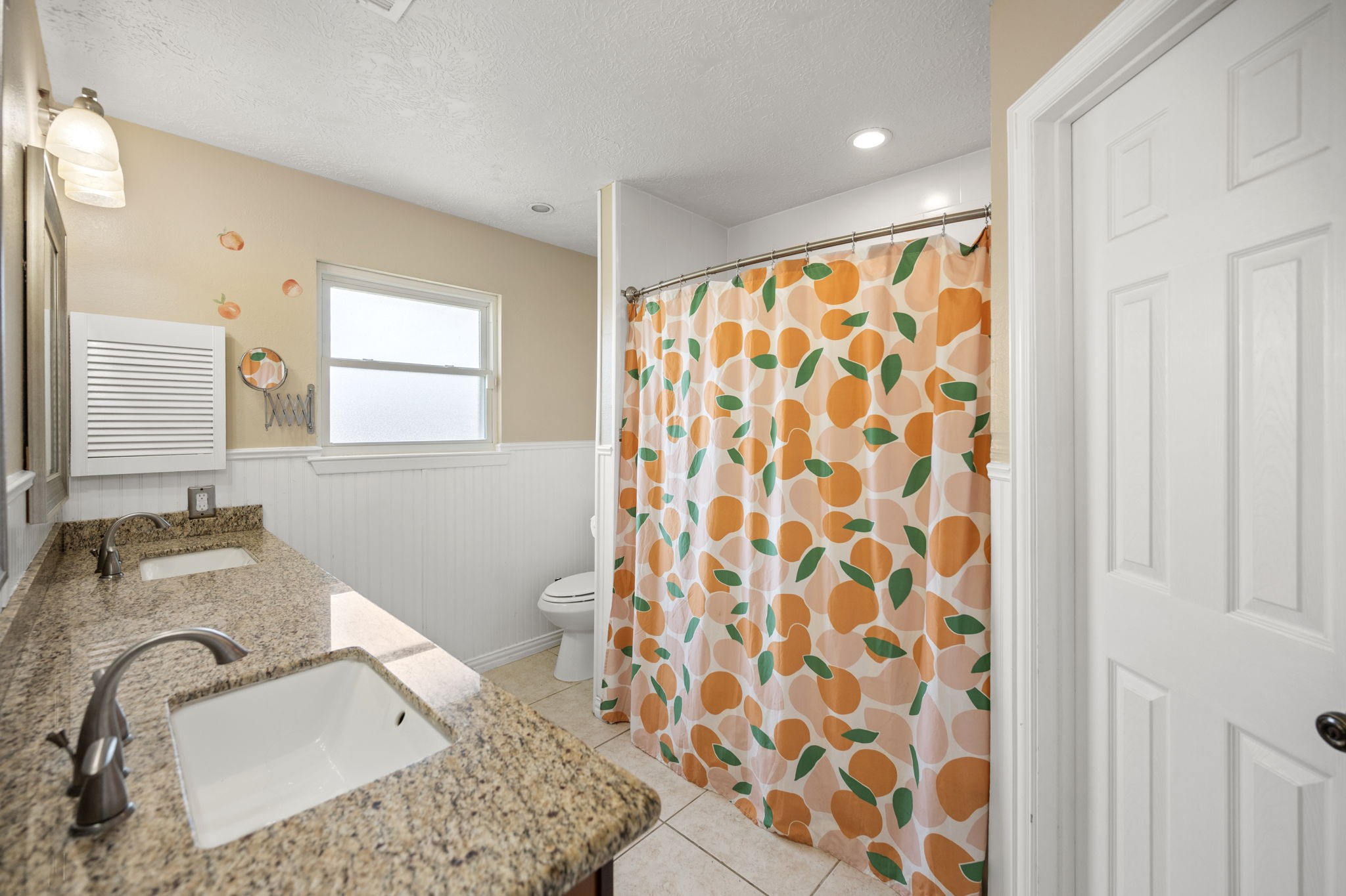 2327 Colonial Ridge Drive Friendswood, TX 77546 - Photo 18 of 27 a bathroom with a granite countertop sink and a mirror