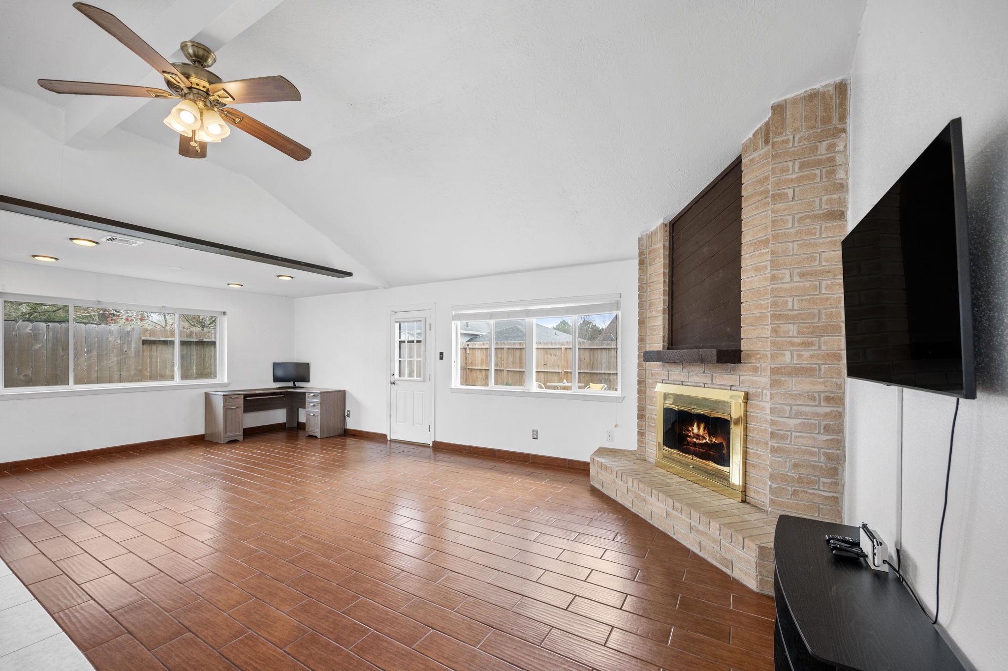 2327 Colonial Ridge Drive Friendswood, TX 77546 - Photo 2 of 27 a view of empty room with fireplace and wooden floor