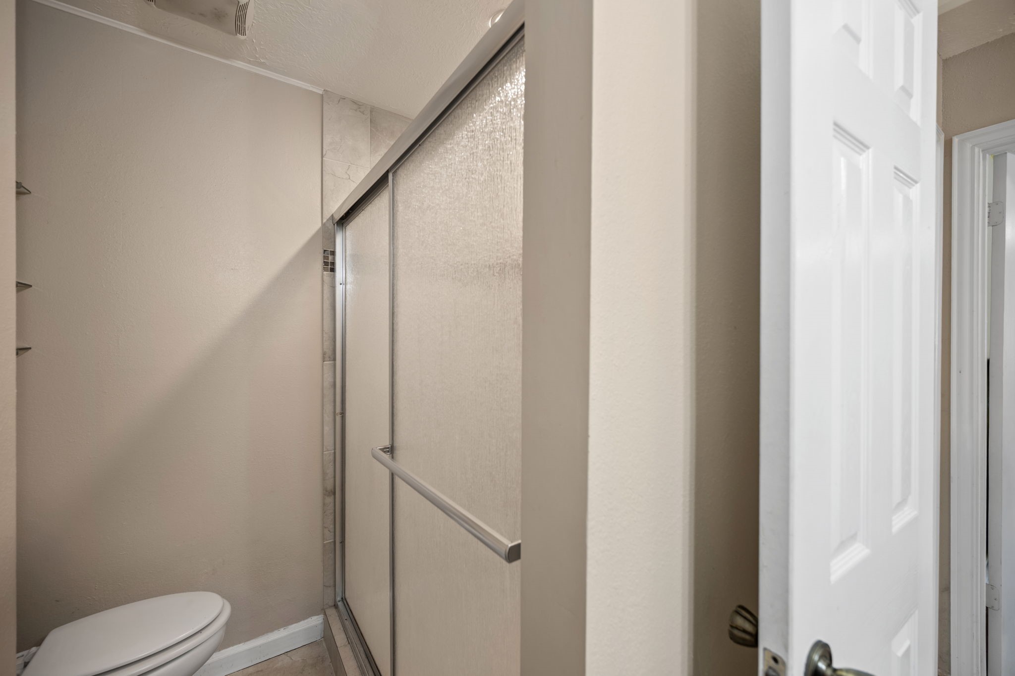 2327 Colonial Ridge Drive Friendswood, TX 77546 - Photo 23 of 27 a bathroom with a toilet and a shower