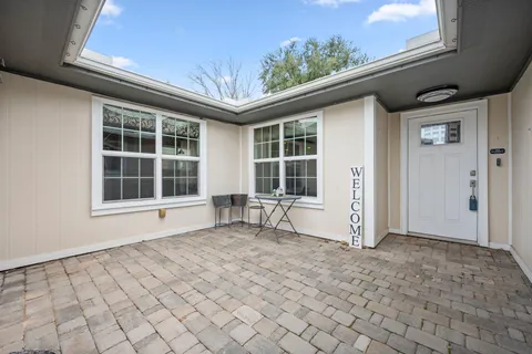 a view of house with backyard