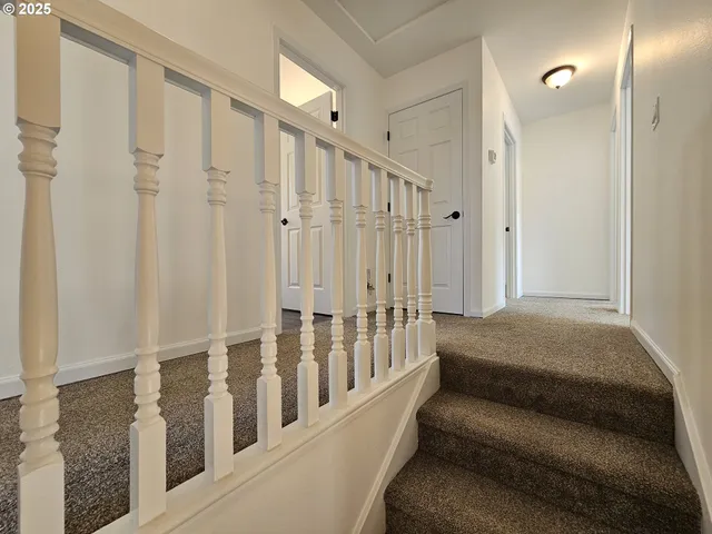a view of staircase with lots of white walls