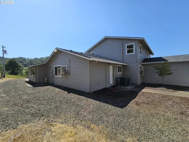 a house view with a backyard space