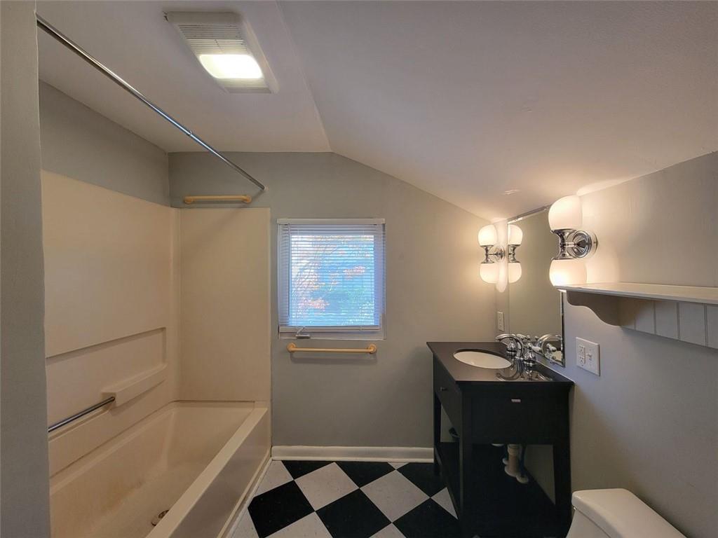 976 Delaware Avenue Southeast, Unit 2 Atlanta, GA 30316 - Photo 12 of 28 a bathroom with a bathtub and a sink