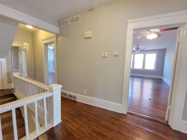 a view of an entryway door with wooden floor