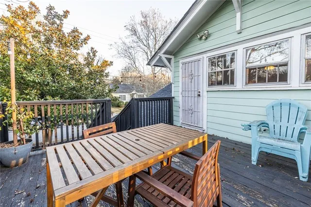 a view of a wooden chairs on the deck