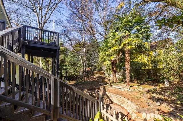 a view of a house with wooden fence