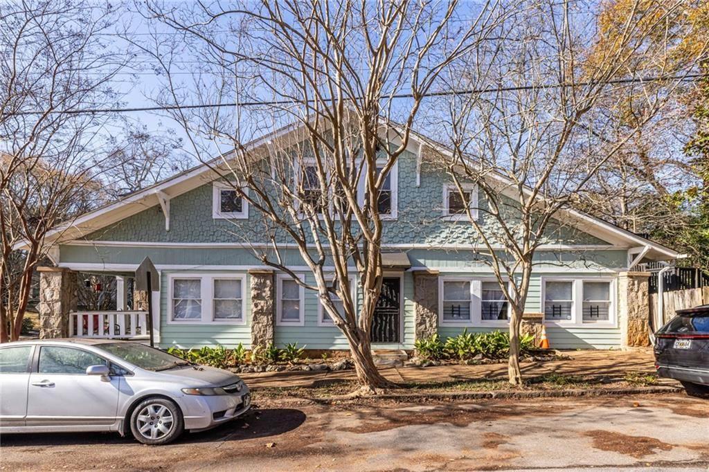 976 Delaware Avenue Southeast, Unit 2 Atlanta, GA 30316 - Photo 3 of 28 a car parked in front of a white house