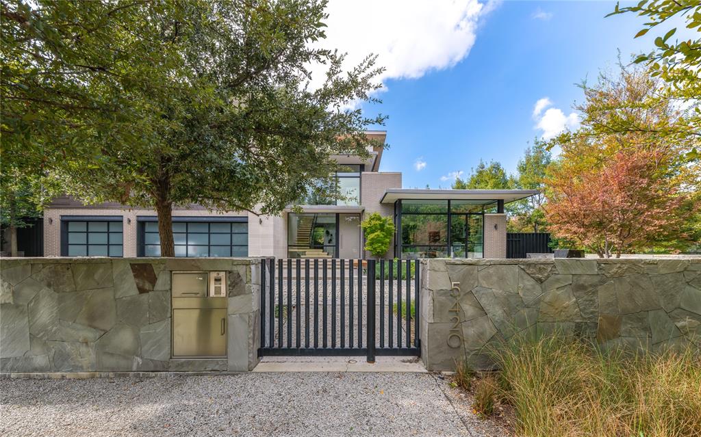 front view of a house with a garden