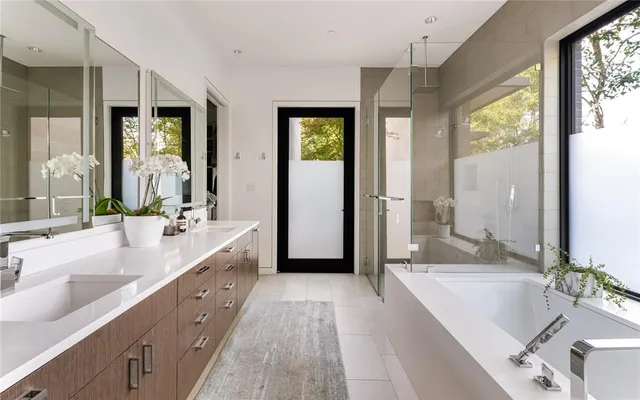 a bathroom with a sink double vanity and a mirror