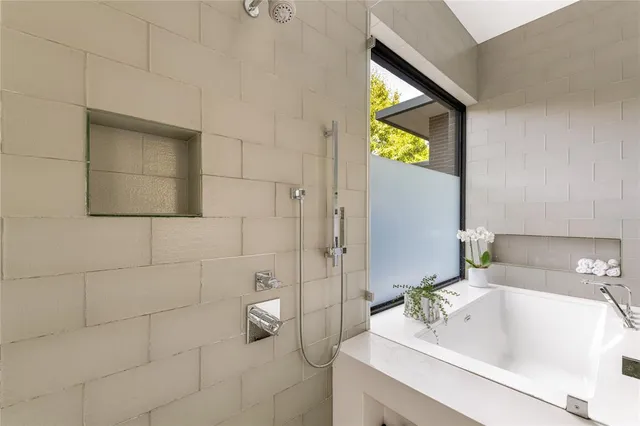 a dining room with furniture a chandelier and wooden floor