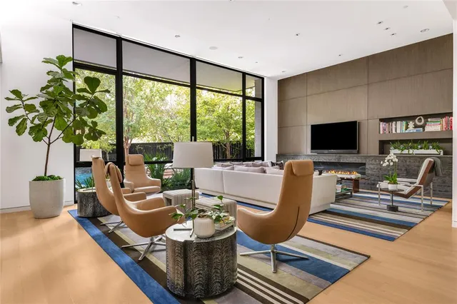 a living room with fireplace furniture and a flat screen tv