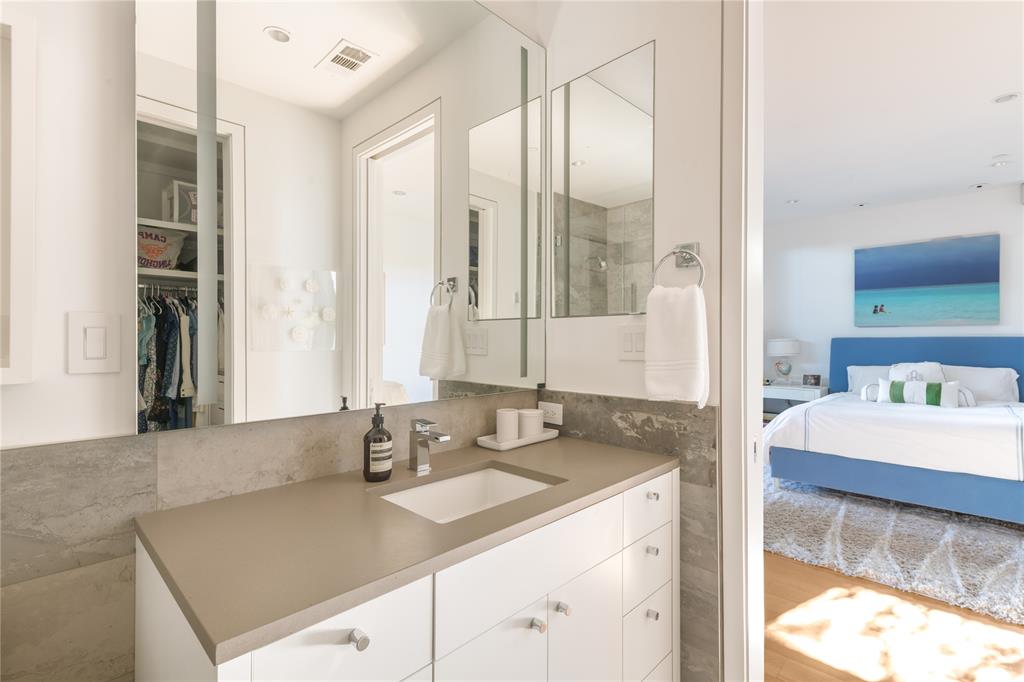 5420 Surrey Circle Dallas, TX 75209 - Photo 26 of 40 a bathroom with a granite countertop sink and a mirror
