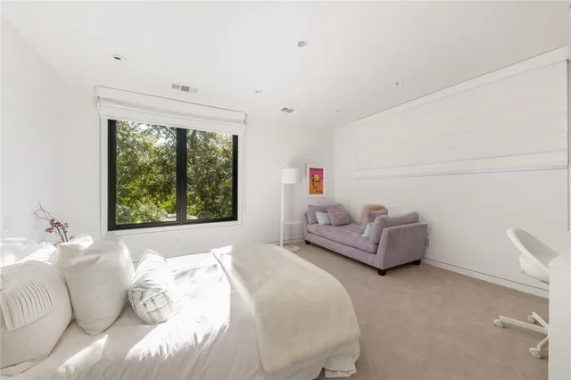 a bathroom with a double vanity sink mirror and shower