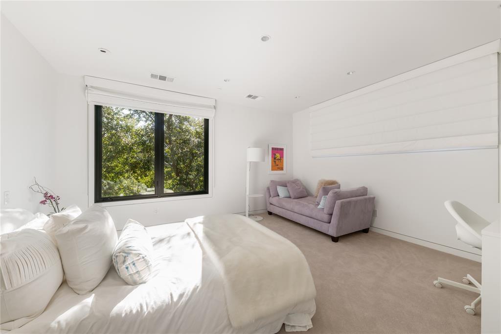 5420 Surrey Circle Dallas, TX 75209 - Photo 34 of 40 a bedroom with a bed and a couch