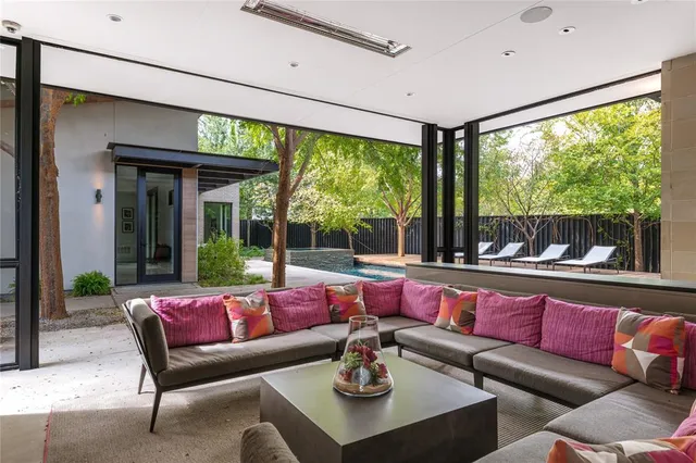 a dining room with furniture and a flat screen tv