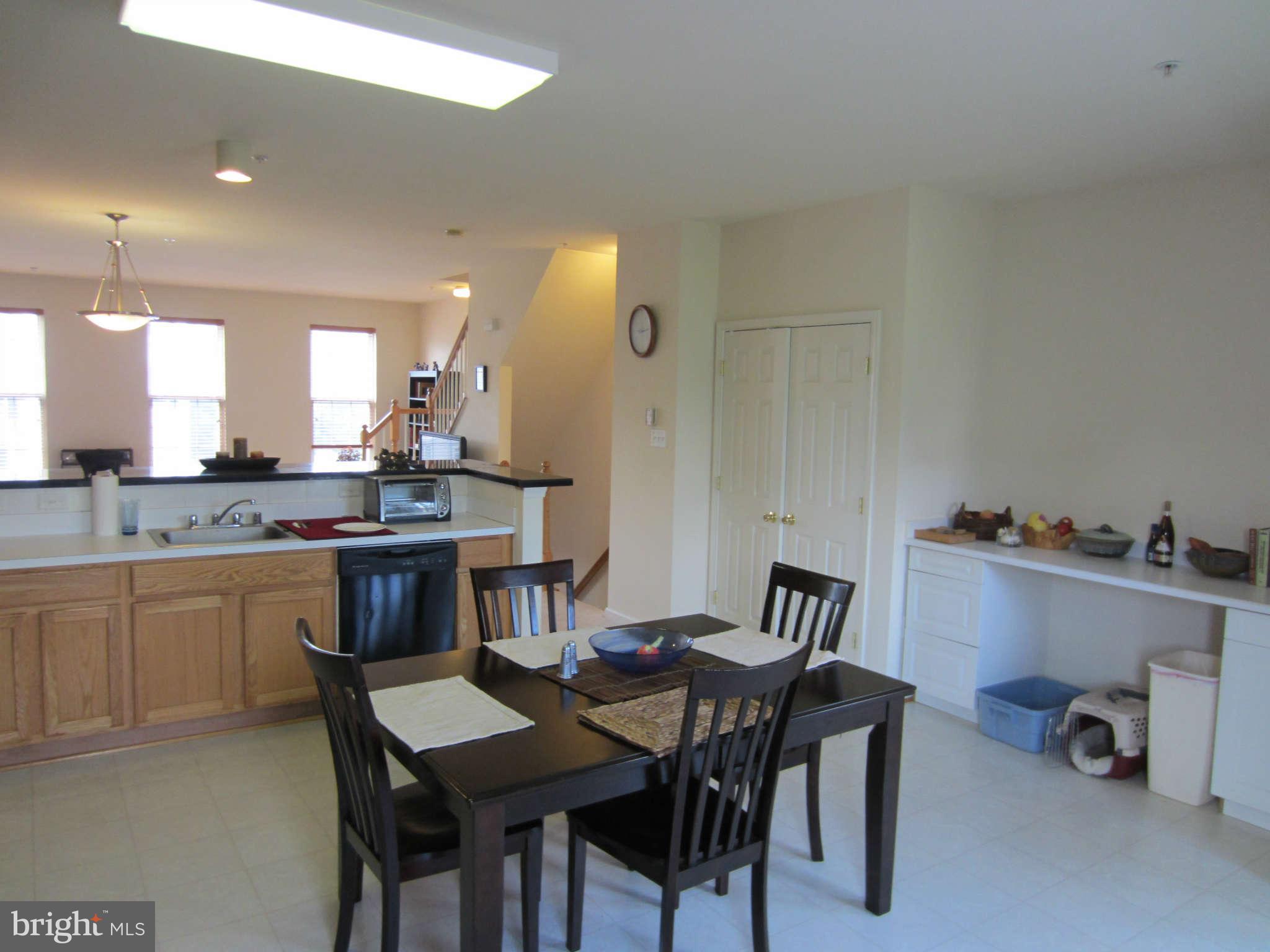 512 Ellison Court Frederick, MD 21703 - Photo 17 of 30 a view of a dining room with furniture and a livingroom
