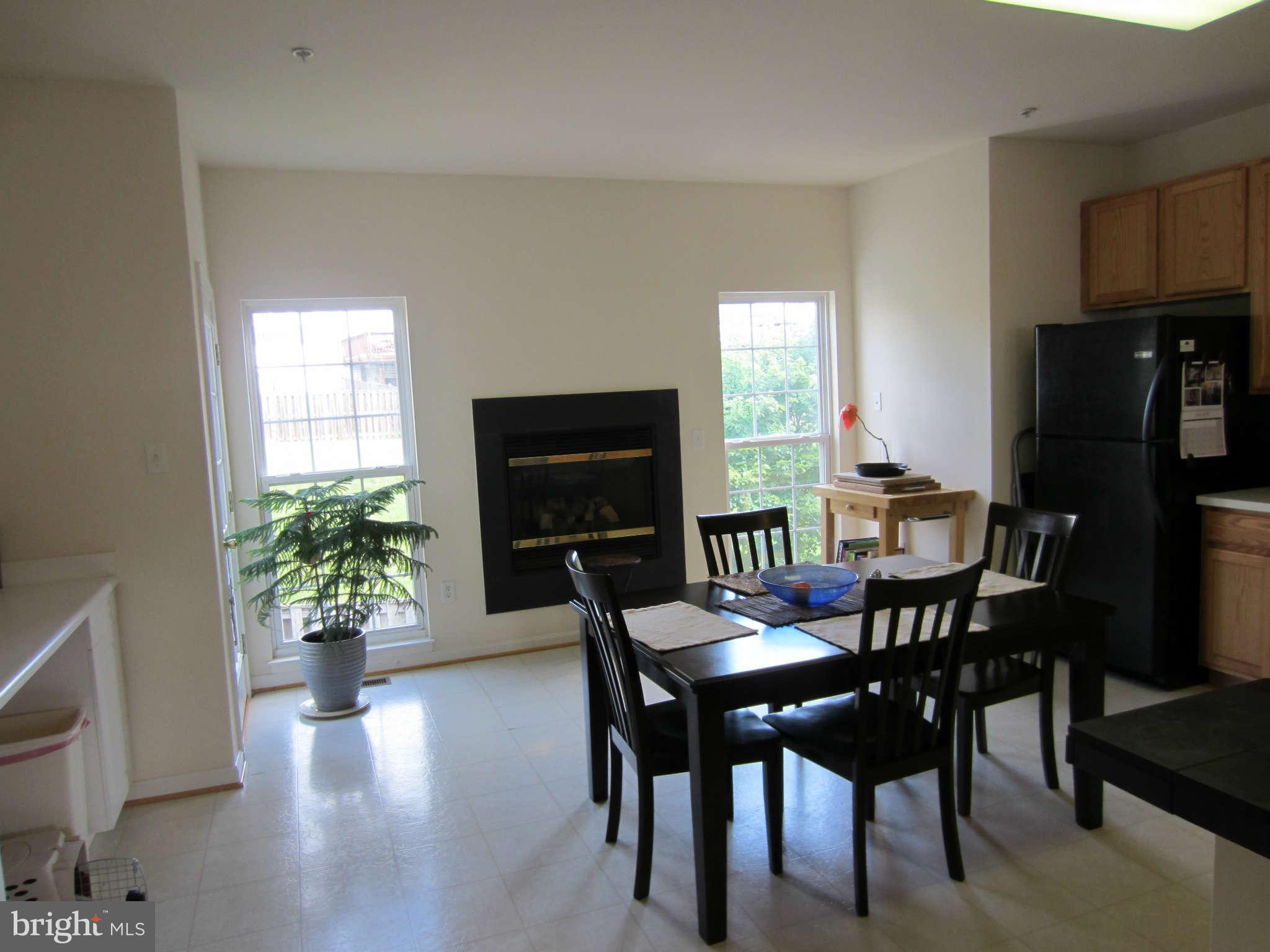 512 Ellison Court Frederick, MD 21703 - Photo 19 of 30 a view of a dining room with furniture window and wooden floor