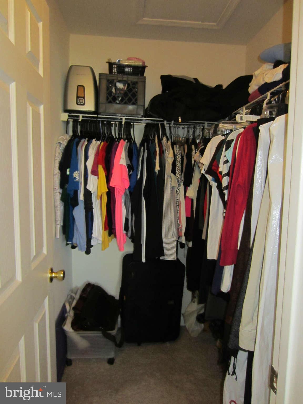 512 Ellison Court Frederick, MD 21703 - Photo 22 of 30 a view of walk in closet with clothes and shoes