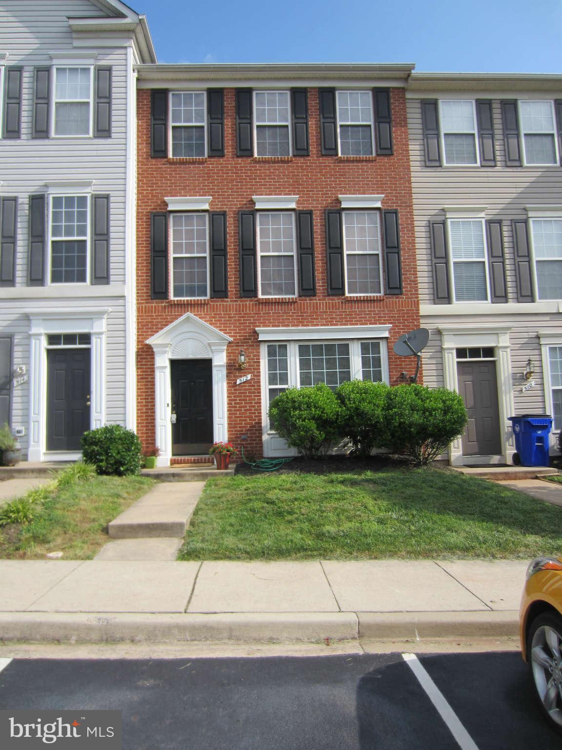 512 Ellison Court Frederick, MD 21703 - Photo 30 of 30 a front view of a residential apartment building with a yard
