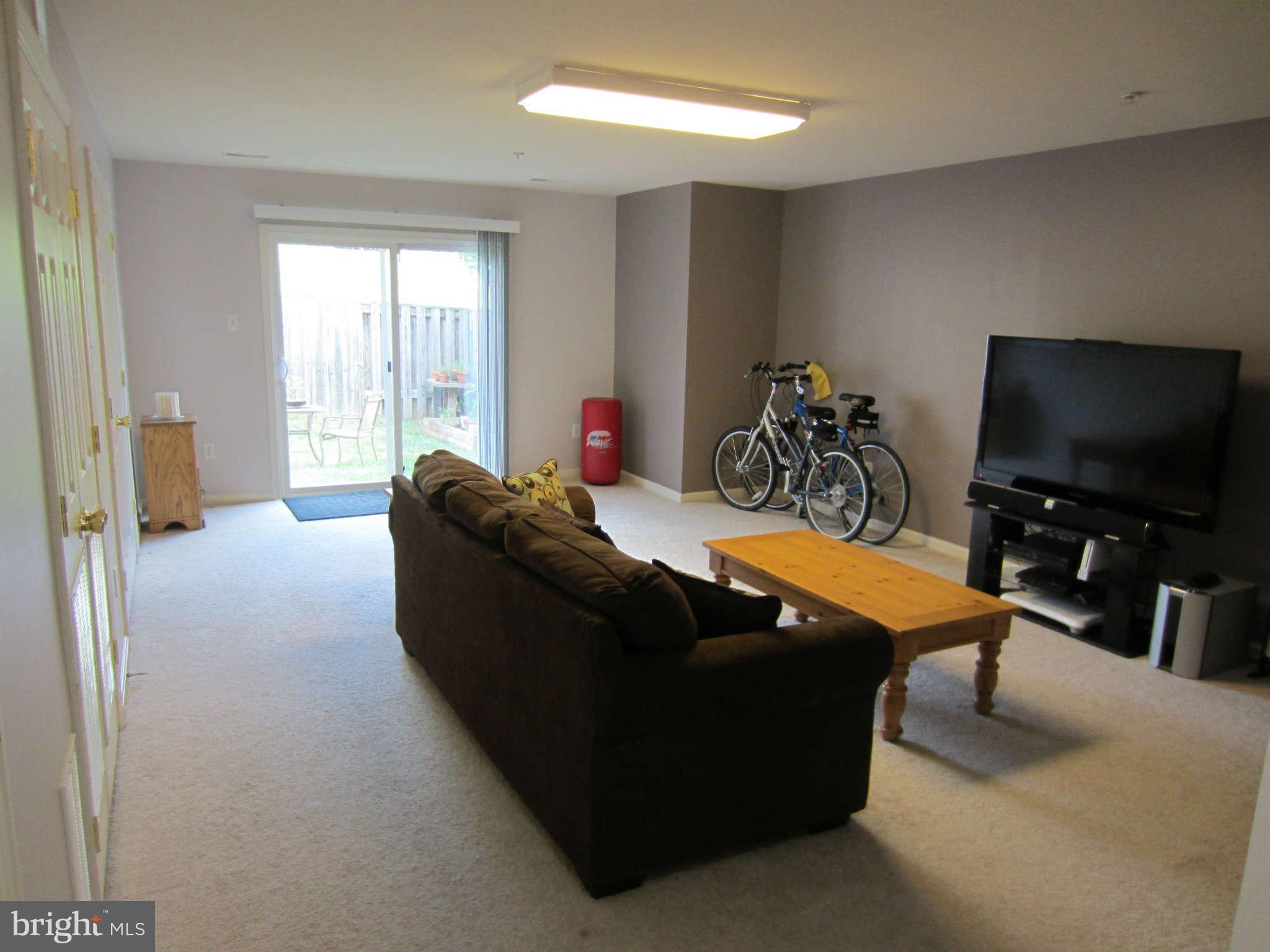 512 Ellison Court Frederick, MD 21703 - Photo 4 of 30 a living room with furniture and a flat screen tv