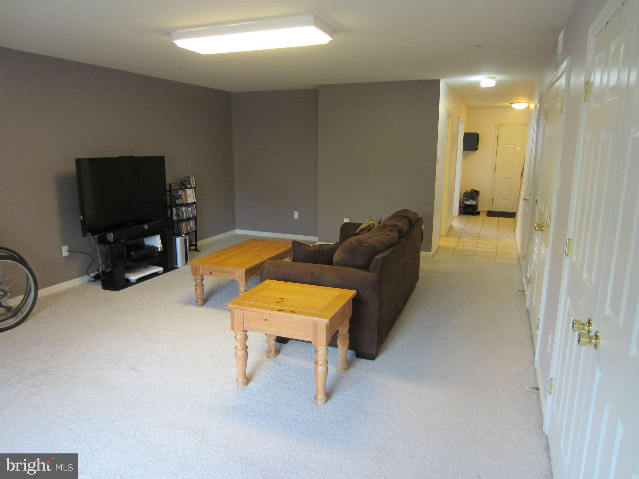 512 Ellison Court Frederick, MD 21703 - Photo 5 of 30 a living room with furniture and a flat screen tv