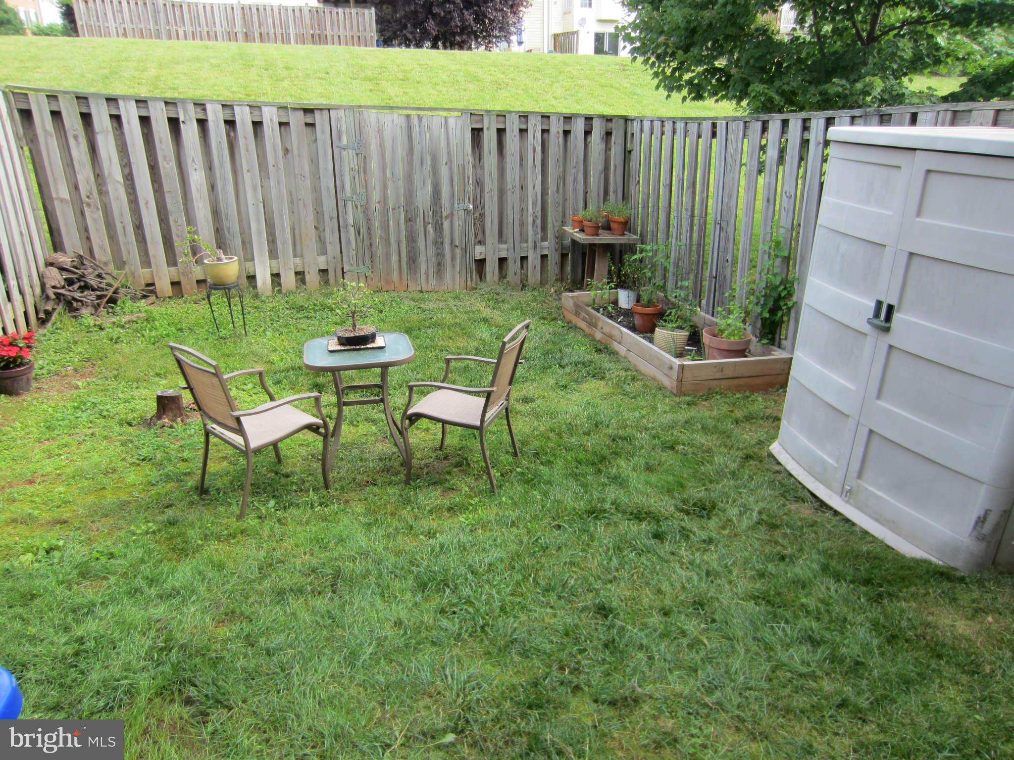 512 Ellison Court Frederick, MD 21703 - Photo 8 of 30 a view of a chairs in backyard of house